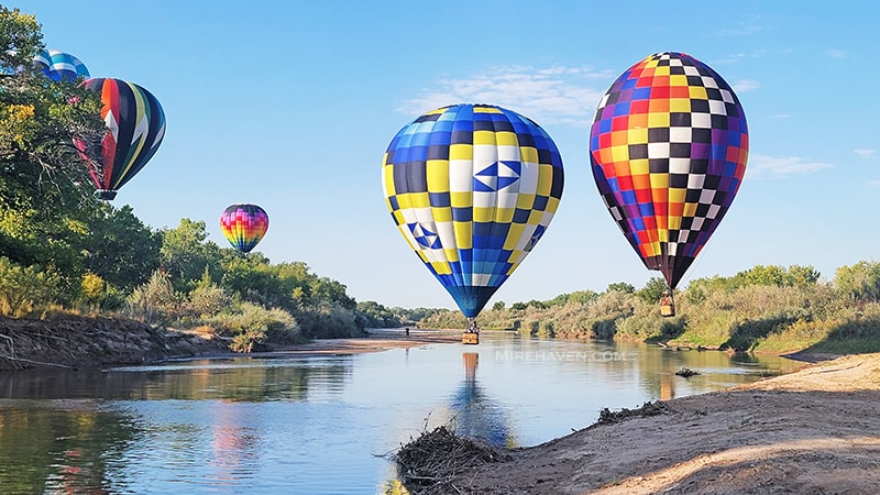 Balloons splashing down into the Rio Grande